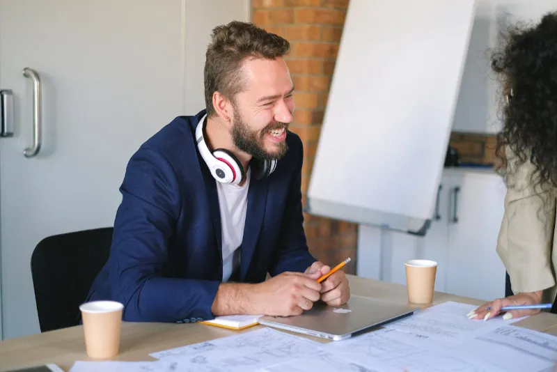 man helping define a custom web design by collecting information