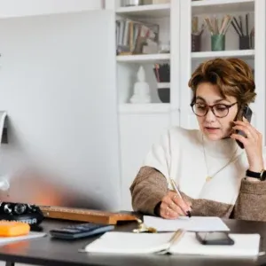 woman on the phone having a web design strategy session call